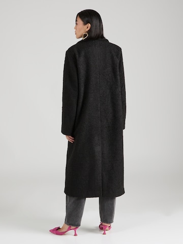 Hoermanseder x About You Between-seasons coat 'Naomi' in Black