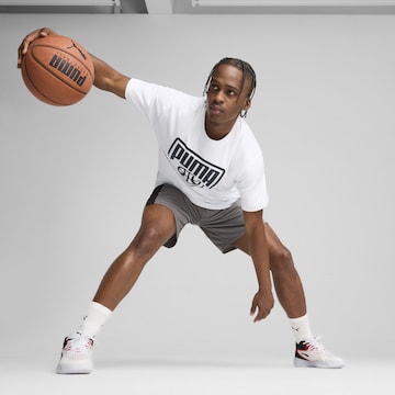 PUMA Performance shirt 'Posterize' in White