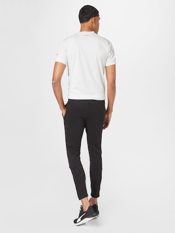 PUMA Tapered Sportbroek in Zwart