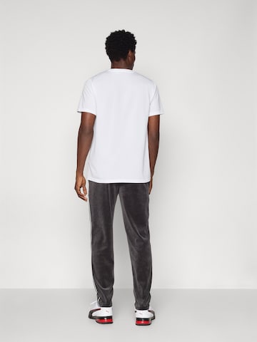 PUMA Regular Broek 'ESS' in Zwart
