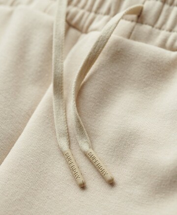 Tapered Pantaloni sport de la Superdry pe bej