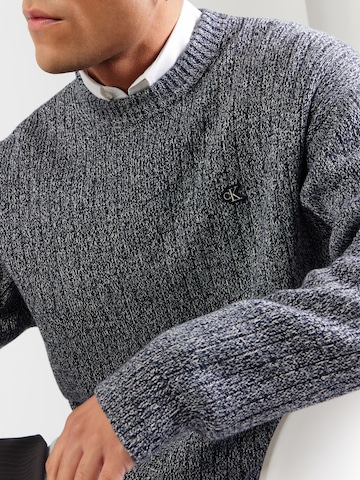 Pull-over Calvin Klein Jeans en gris