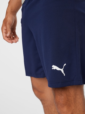 PUMA Štandardný strih Športové nohavice 'TeamRise' - Modrá