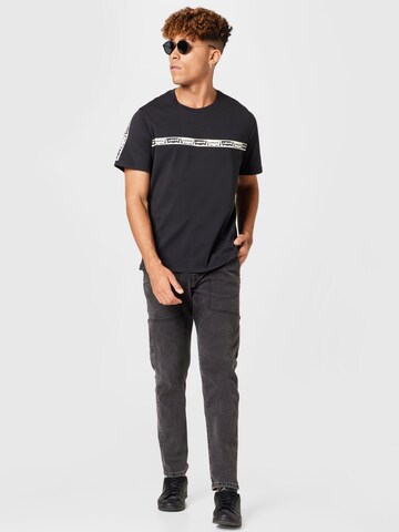 LEVI'S ® - Camisa 'SS Relaxed Fit Tee' em preto