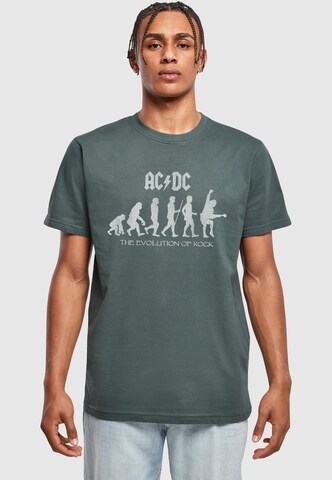 Merchcode T-Shirt 'ACDC - Evolution Of Rock' in Grün: Vorderseite