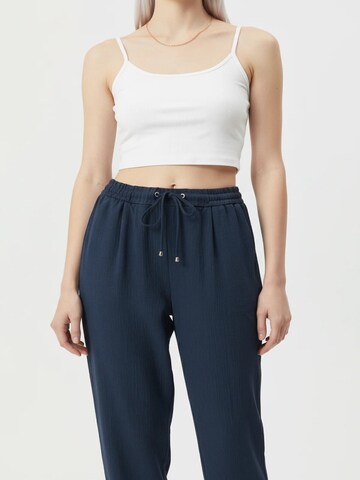 No Matter What Tapered Pleat-front trousers in Blue