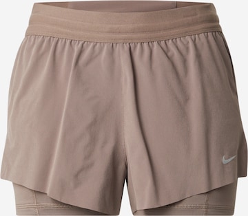 NIKE Свободный крой Спортивные штаны в Коричневый: спереди