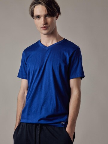 T-Shirt 'T-Shirt Scollo a V' OWN Off With Nature en bleu : devant