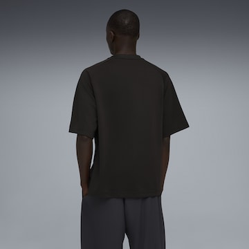 PUMA Functioneel shirt 'T7 Big Cat' in Zwart