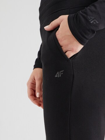 Effilé Pantalon de sport 4F en noir