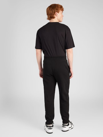 Tapered Pantaloni 'Nuram' di HUGO in nero