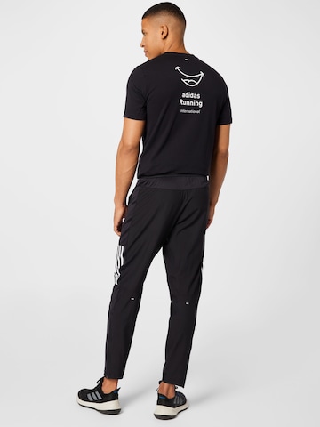 ADIDAS SPORTSWEAR Slimfit Sporthose 'Own The Run Astro Wind' in Schwarz