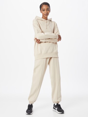 Nike Sportswear Tapered Broek in Beige
