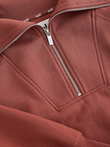 self. - Sudadera en marrón