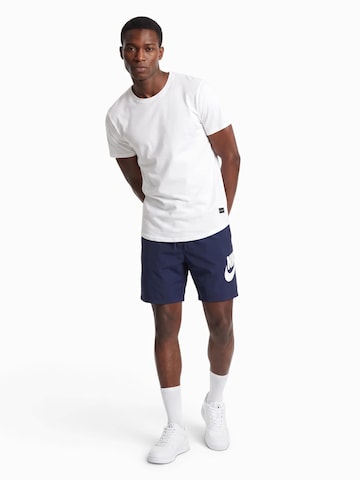 Nike Sportswear Voľný strih Nohavice 'CLUB' - Modrá