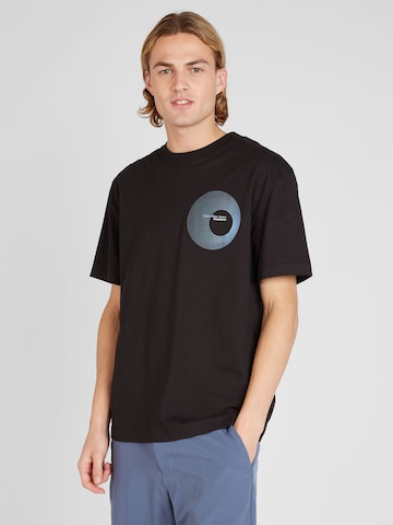 Loosefit T-shirt Calvin Klein Jeans en noir : devant