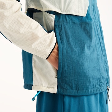 new balance - Chaqueta deportiva en azul