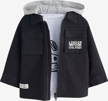 Next Setti värissä musta: etupuoli