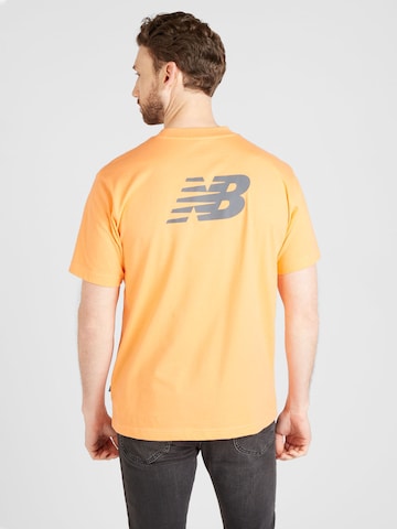 new balance T-shirt i orange