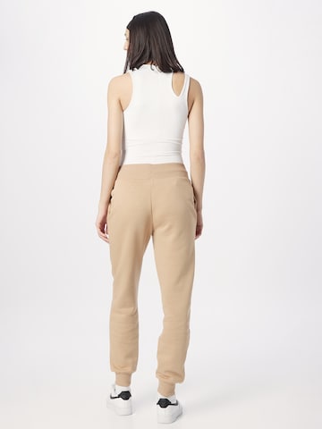 Tapered Pantaloni di Nike Sportswear in beige