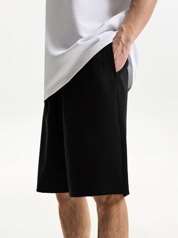 Loosefit Pantaloni di Bershka in nero: frontale