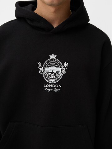 Sweat-shirt Bershka en noir