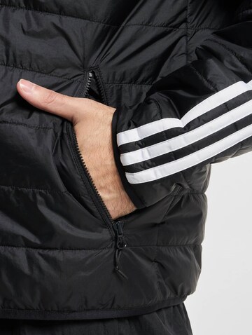 ADIDAS ORIGINALS Jacke in Schwarz