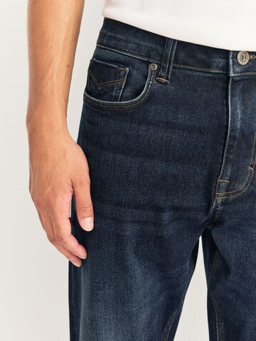 Coupe slim Jean 'Motion Flex' Next en bleu