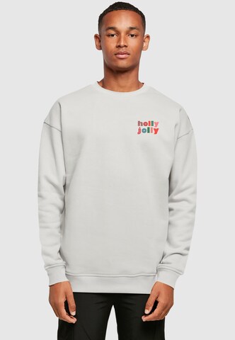 Sweat-shirt 'Holly Jolly Mood' Merchcode en gris : devant