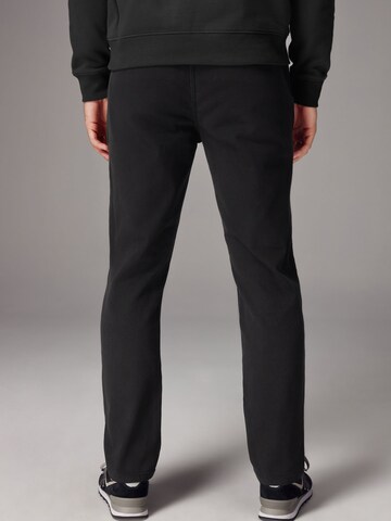Slimfit Pantaloni chino di Next in nero