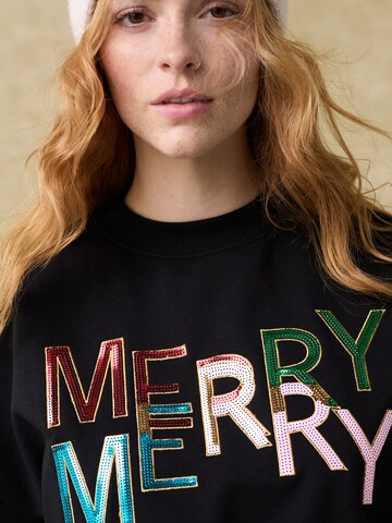 Next Sweatshirt 'Merry Merry' in Schwarz