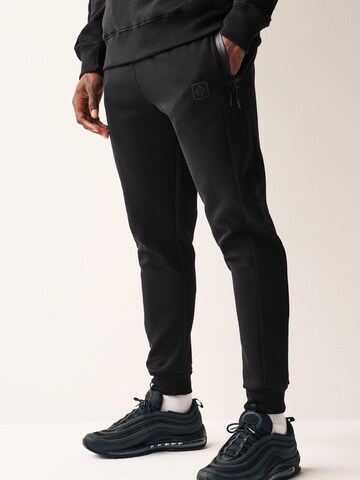 Tapered Pantaloni funzionali di Next in nero: frontale