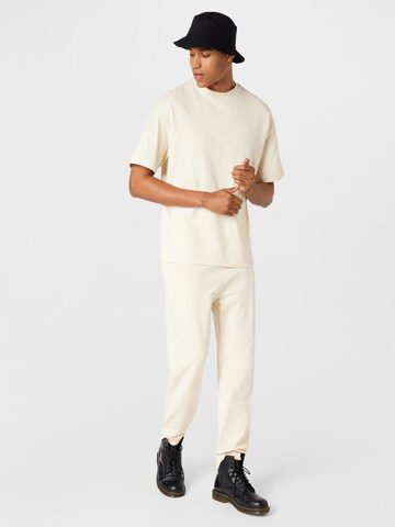 ABOUT YOU Limited Loose fit Pants 'Rico' in Beige