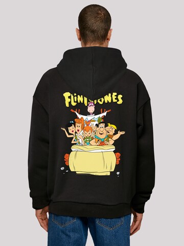 Sweat-shirt 'The Flintstones The Ride Familie Feuerstein' F4NT4STIC en noir : devant