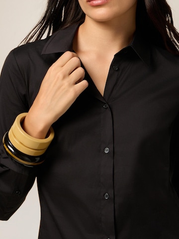oltre Bluse‌‌‌‌‌‌‌‌‌ in Schwarz