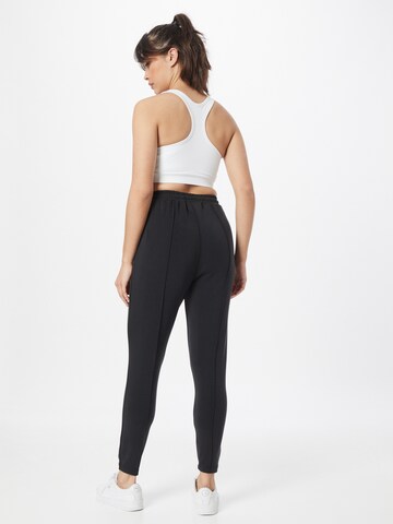 Athlecia Skinny Športové nohavice 'Jacey' - Čierna