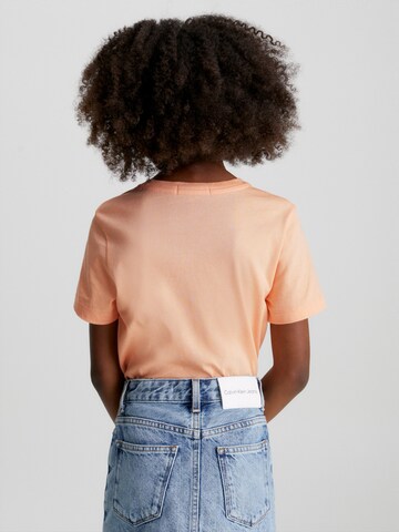 Maglietta di Calvin Klein Jeans in arancione