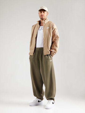 Nike Sportswear Tapered Housut 'CLUB' värissä vihreä