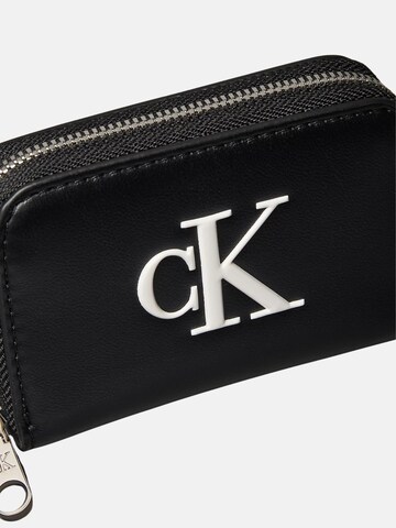 Calvin Klein Peněženka 'CALVIN KLEIN BOLD CK MEDIUM ZIP AROUND Portafoglio' – černá