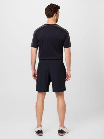 UNDER ARMOUR Regular Sports trousers in Black