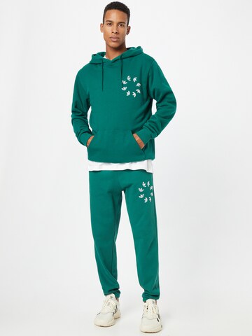 žalia ADIDAS ORIGINALS Siaurėjantis Kelnės 'Spinner'