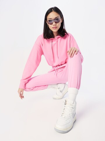 Felpa di Champion Authentic Athletic Apparel in rosa