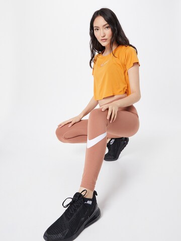 Skinny Leggings 'Essential' di NIKE in marrone