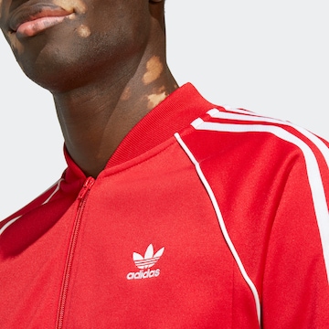 Veste de survêtement 'Adicolor Classics Sst' ADIDAS ORIGINALS en rouge