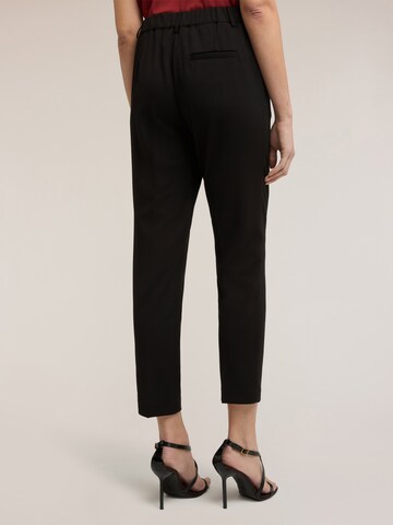 Loosefit Pantalon MOTIVI en noir