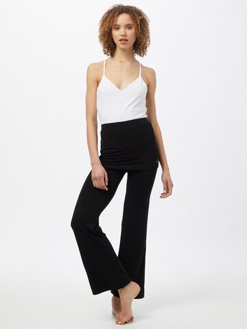 CURARE Yogawear - Tapered Pantalón deportivo en negro