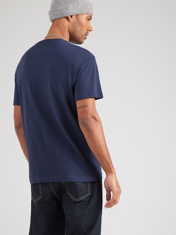 Tricou de la Lee pe albastru: spate