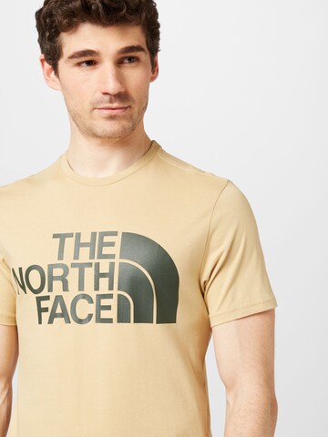 THE NORTH FACE T-shirt i gul