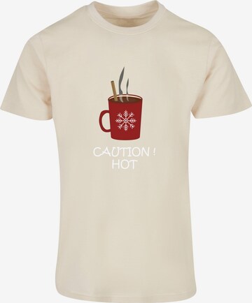 Merchcode T-Shirt 'Caution Hot' in Beige: predná strana