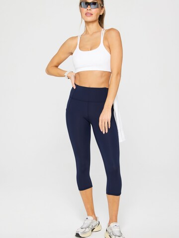 Fabletics Regular Hose 'OASIS HIGH-WAISTED CAPRI' in Blau